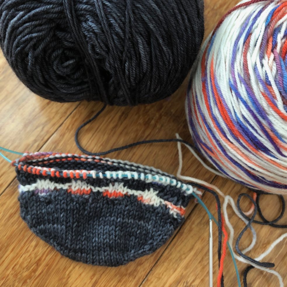 A sock in progress: two colors, started at the toe