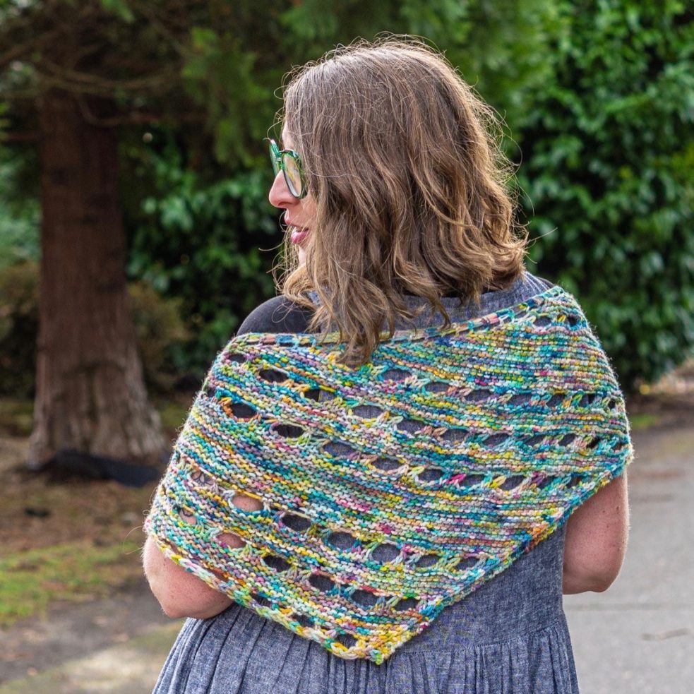 euanthe shawl worn across shannon's shoulders, shown from the back